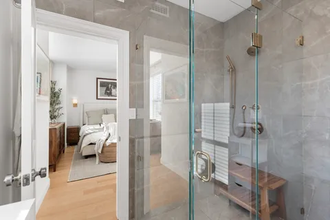 a bedroom with a bed and a view of bathroom