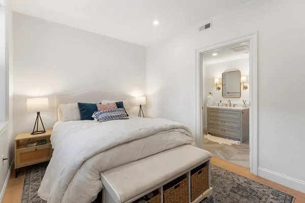 a bedroom with a bed and a bathroom
