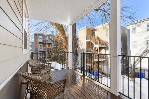 a view of balcony with furniture