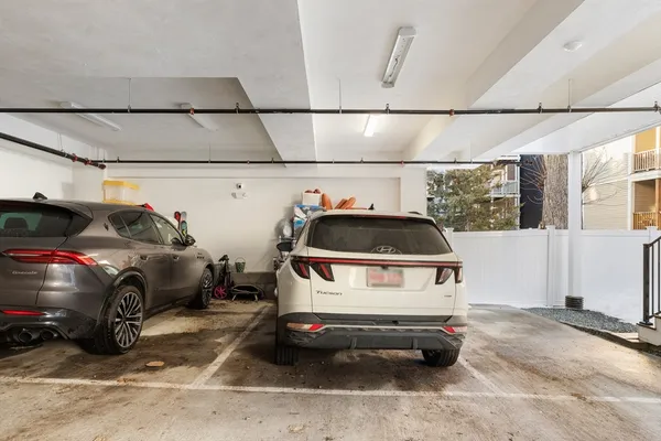 a car parked in a parking lot of a garage