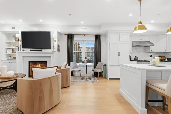 a living room with fireplace furniture and a flat screen tv