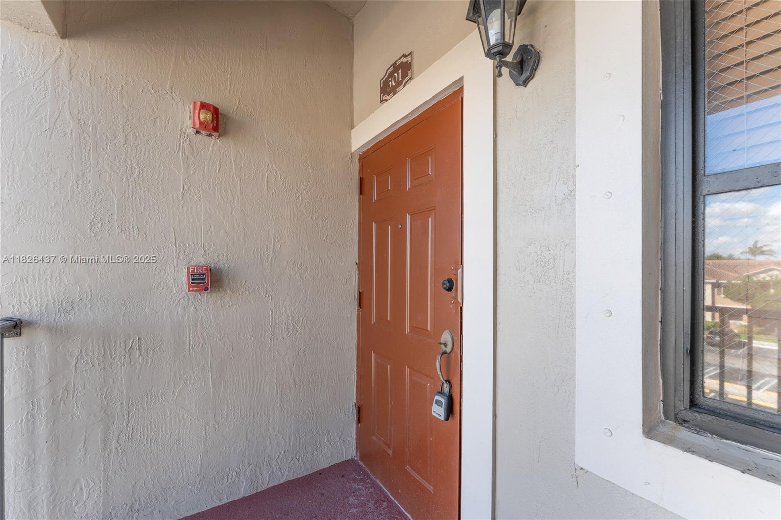 22921 Southwest 88th Place, Unit 301 Cutler Bay, FL 33190 - Photo 2 of 24 a bathroom with a shower and a window