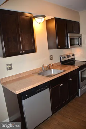 a kitchen with a sink and a microwave