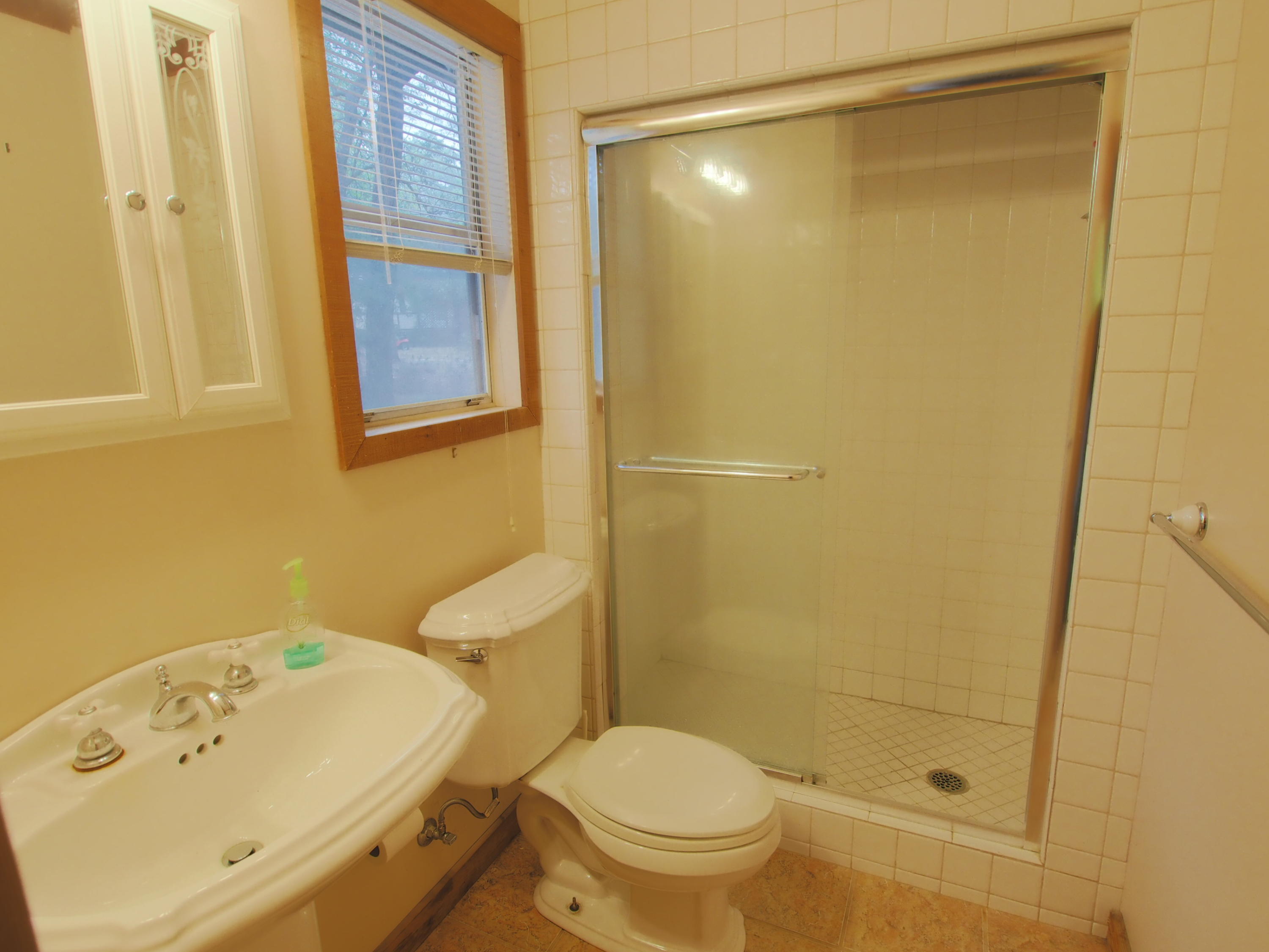 240 Roberts Road East DeFuniak Springs, FL 32433 - Photo 11 of 26 a bathroom with a sink and a shower