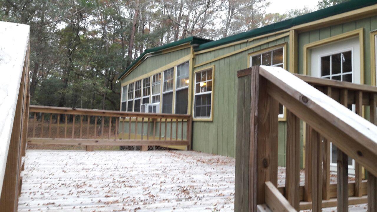 240 Roberts Road East DeFuniak Springs, FL 32433 - Photo 16 of 26 a backyard of a house with seating space