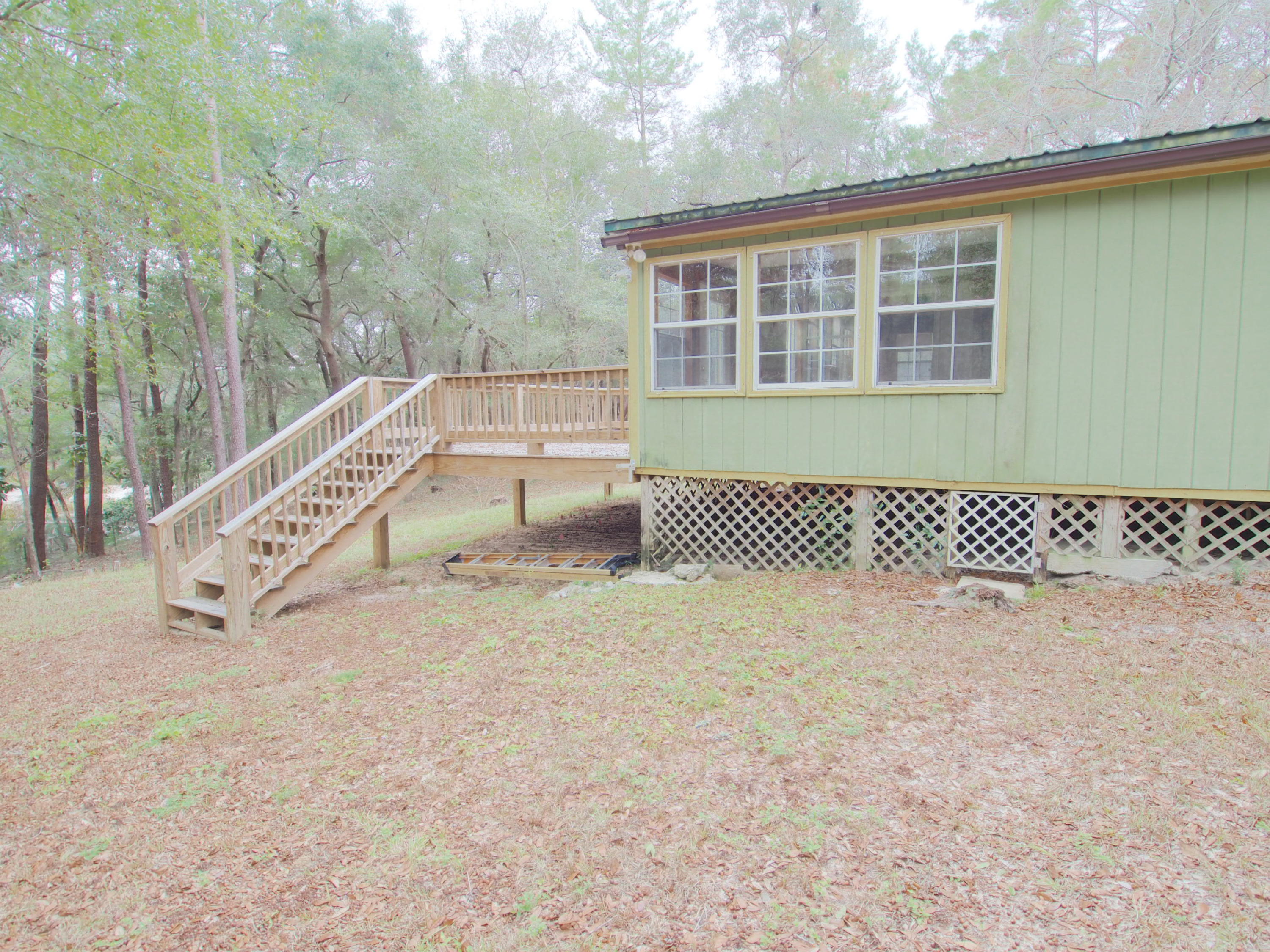 240 Roberts Road East DeFuniak Springs, FL 32433 - Photo 21 of 26 a view of a large white building