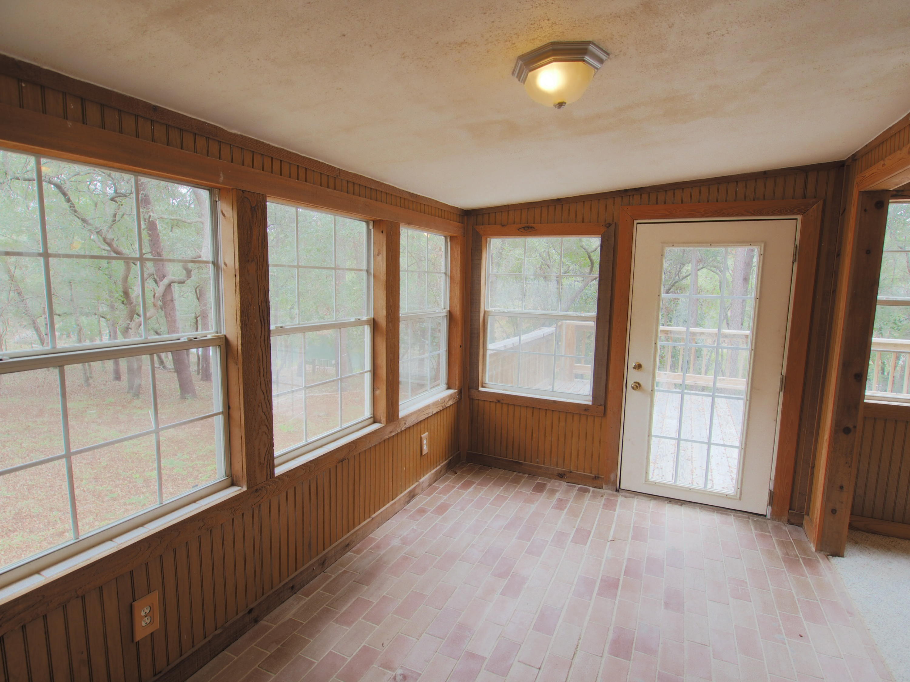 240 Roberts Road East DeFuniak Springs, FL 32433 - Photo 9 of 26 wooden floor in an empty room with a window