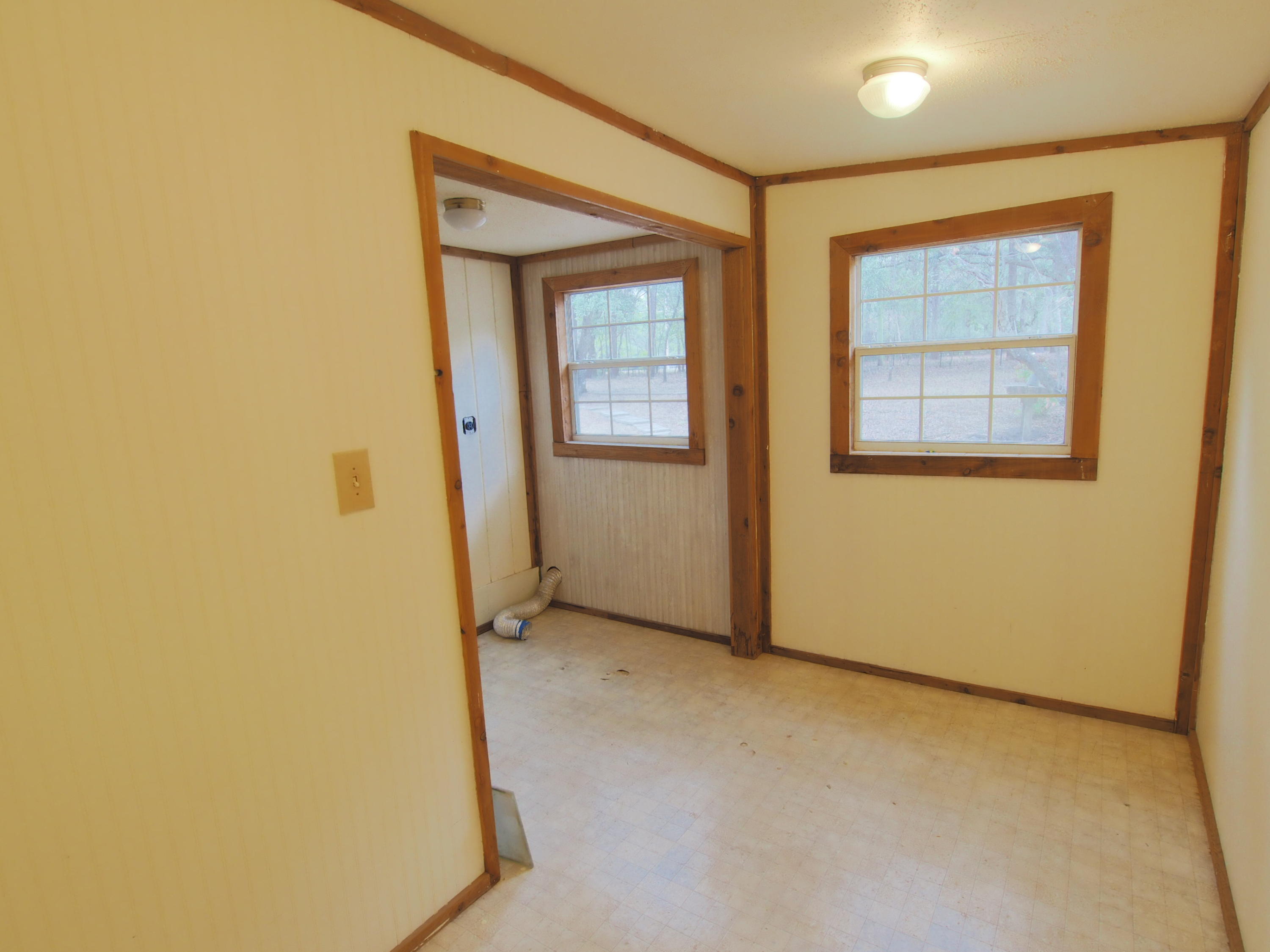 240 Roberts Road East DeFuniak Springs, FL 32433 - Photo 10 of 26 an empty room with windows