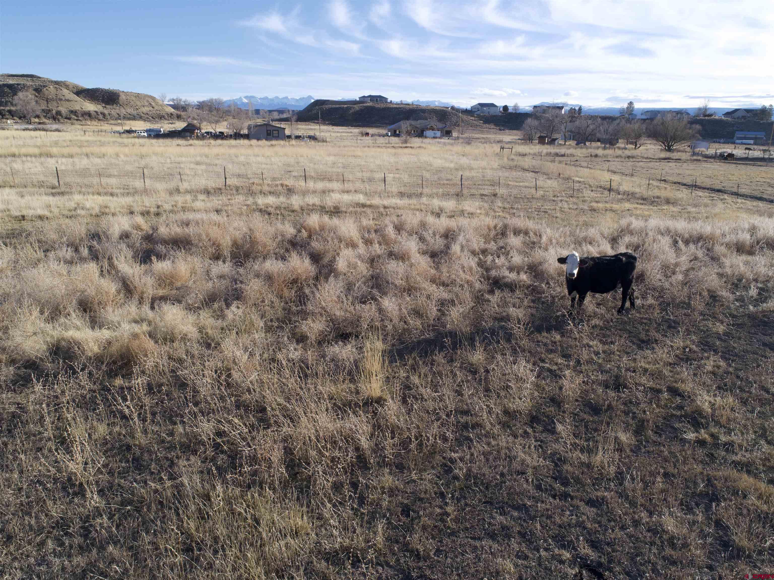 Tract A East Oak Grove Road Montrose, CO 81401 - Photo 6 of 12 a view of a lake with houses in the background