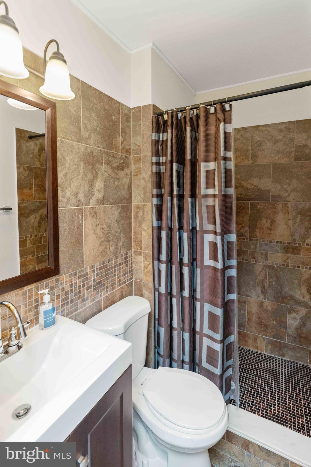 137 Idlewild Road Levittown, PA 19057 - Photo 11 of 34 a bathroom with a sink toilet and shower