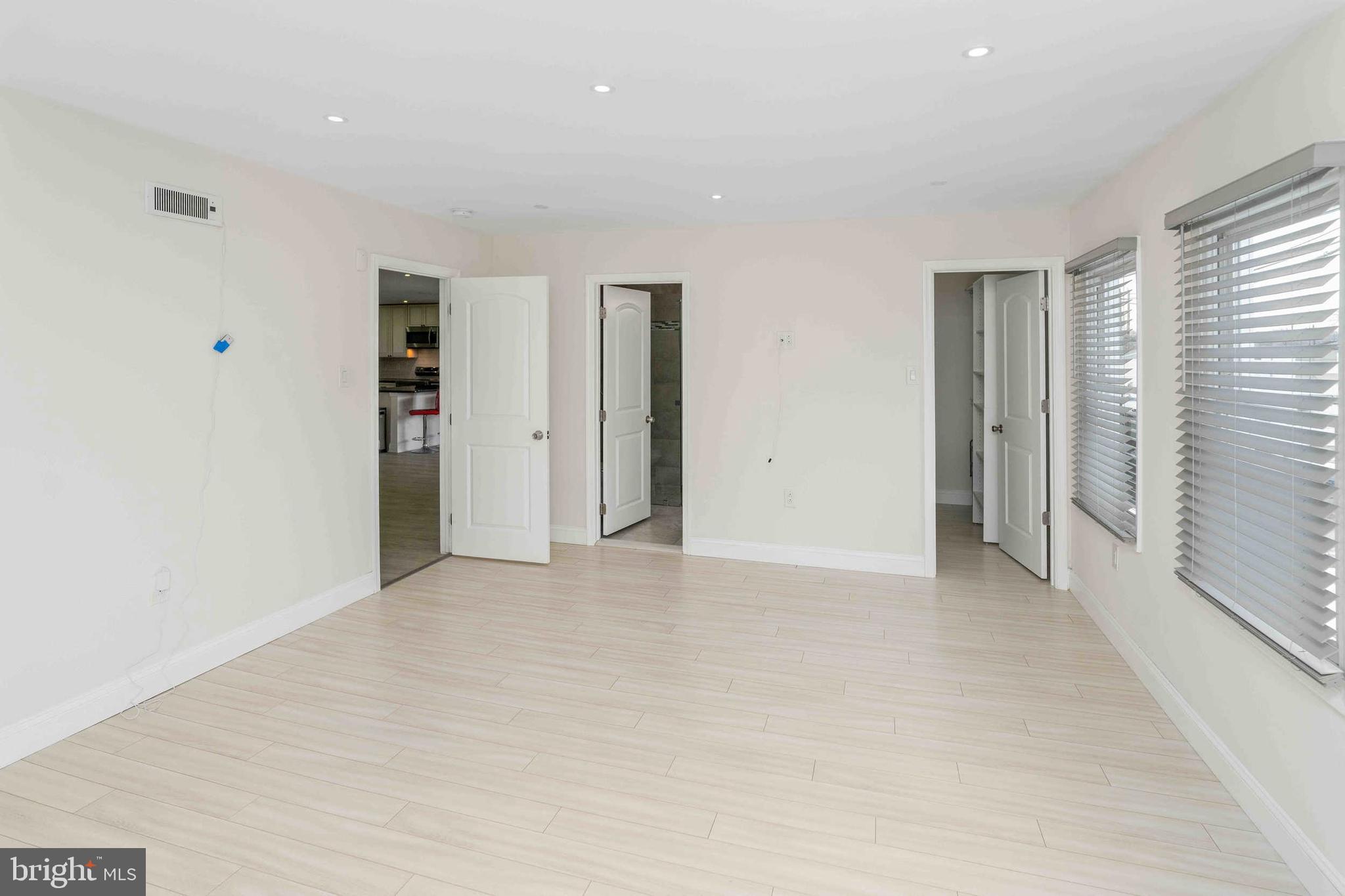 137 Idlewild Road Levittown, PA 19057 - Photo 12 of 34 an empty room with closet and windows