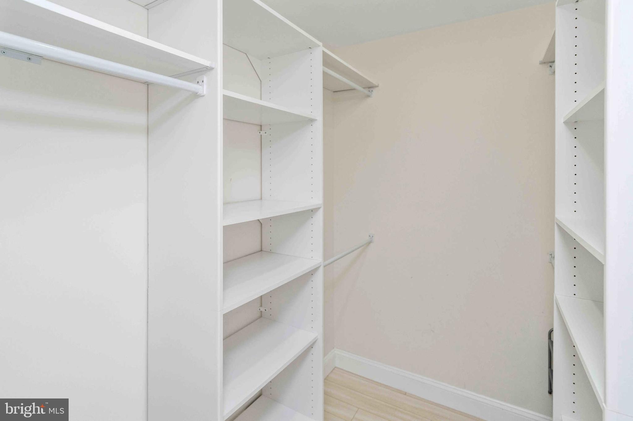 137 Idlewild Road Levittown, PA 19057 - Photo 17 of 34 a view of walk in closet with empty racks