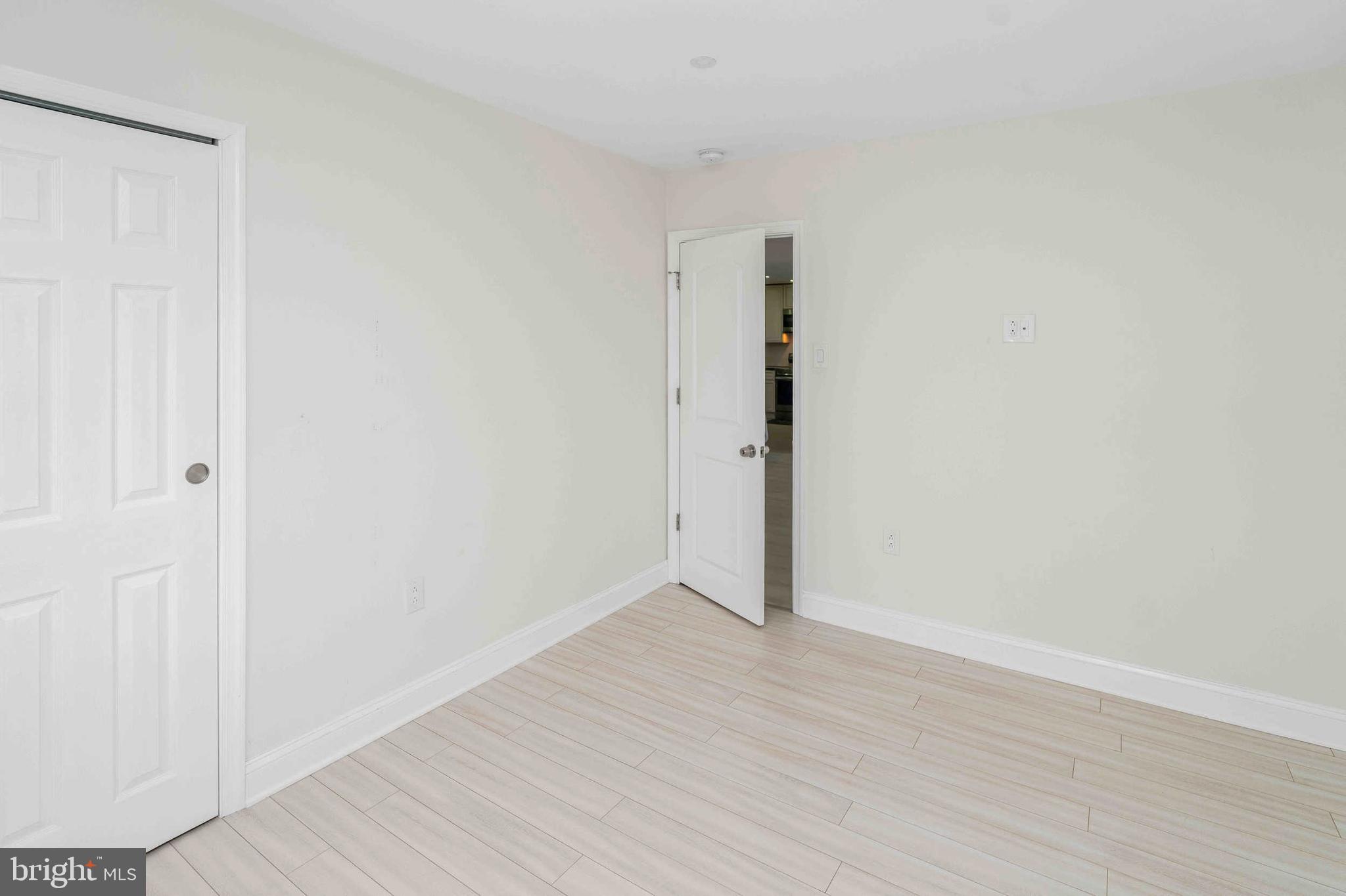 137 Idlewild Road Levittown, PA 19057 - Photo 19 of 34 a view of an empty room with wooden floor