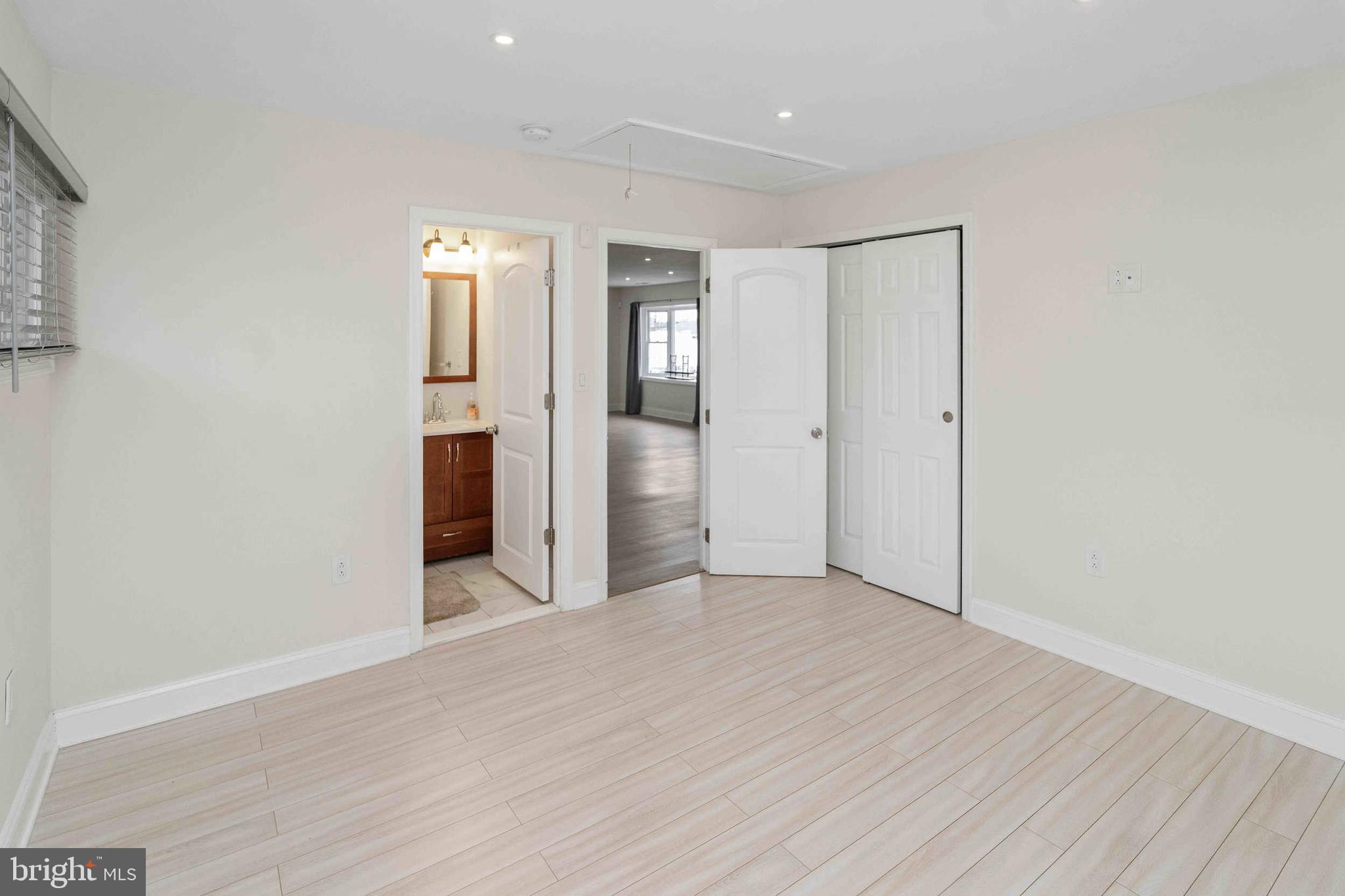 137 Idlewild Road Levittown, PA 19057 - Photo 21 of 34 a view of an empty room with wooden floor and closet