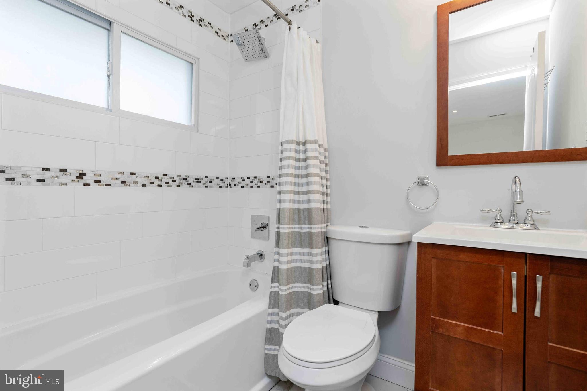 137 Idlewild Road Levittown, PA 19057 - Photo 22 of 34 a bathroom with a toilet a sink and bathtub