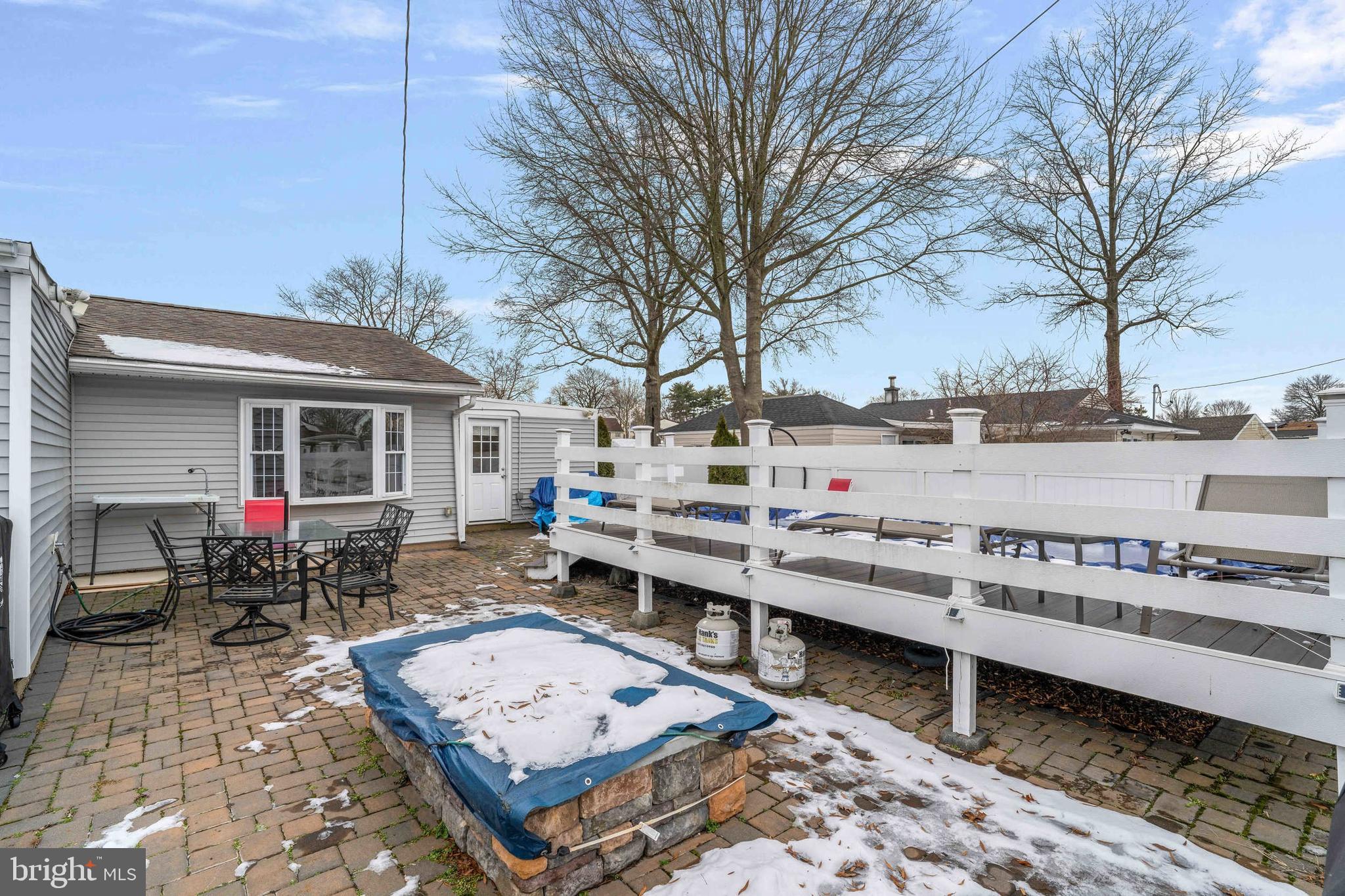 137 Idlewild Road Levittown, PA 19057 - Photo 29 of 34 a backyard of a house with barbeque oven table and chairs