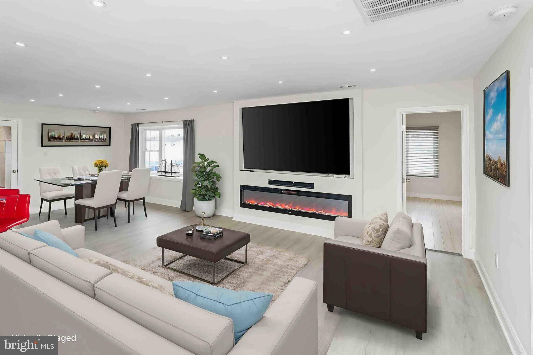 137 Idlewild Road Levittown, PA 19057 - Photo 9 of 34 a living room with furniture and a flat screen tv