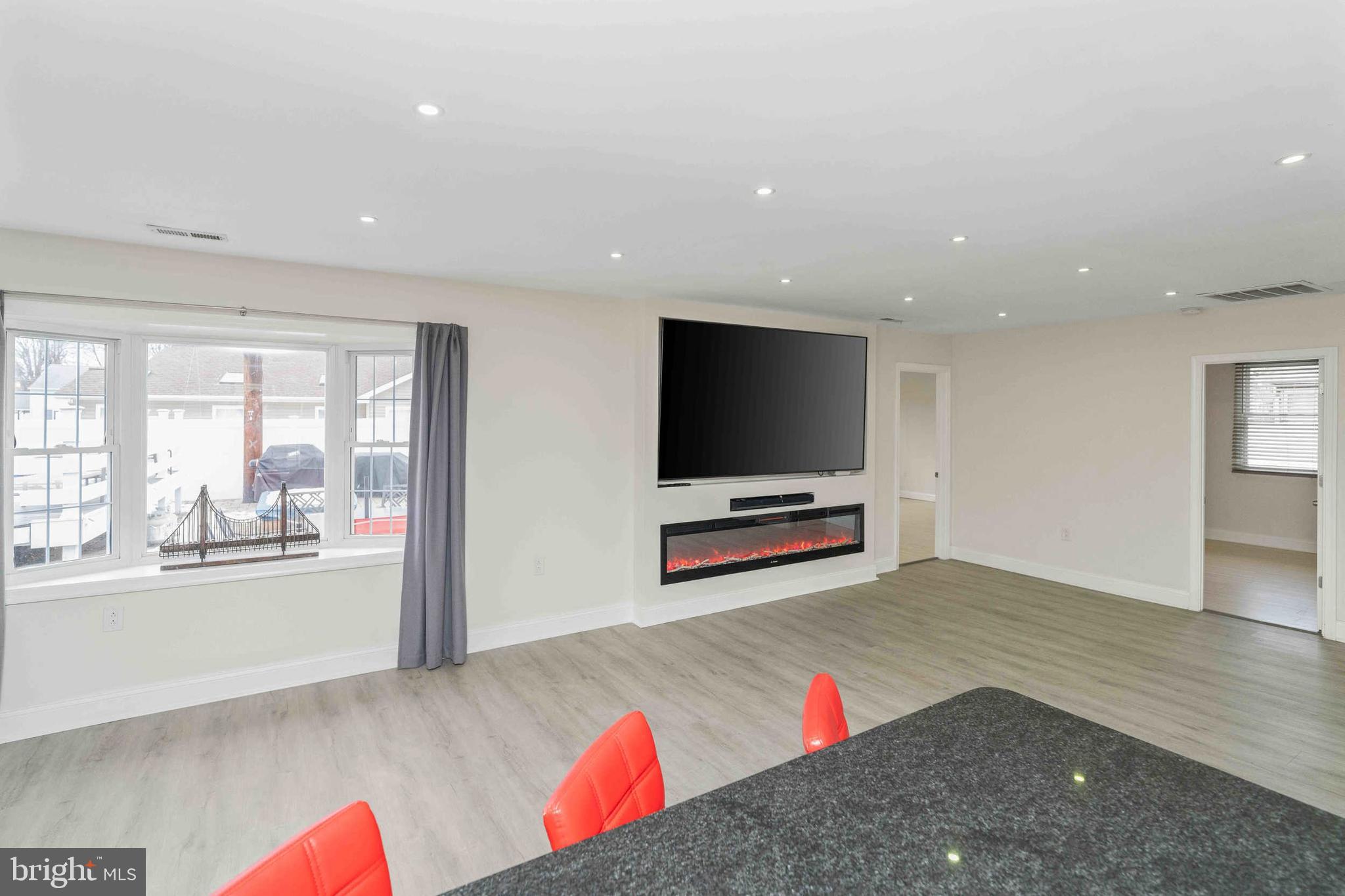 137 Idlewild Road Levittown, PA 19057 - Photo 10 of 34 a living room with furniture and a flat screen tv