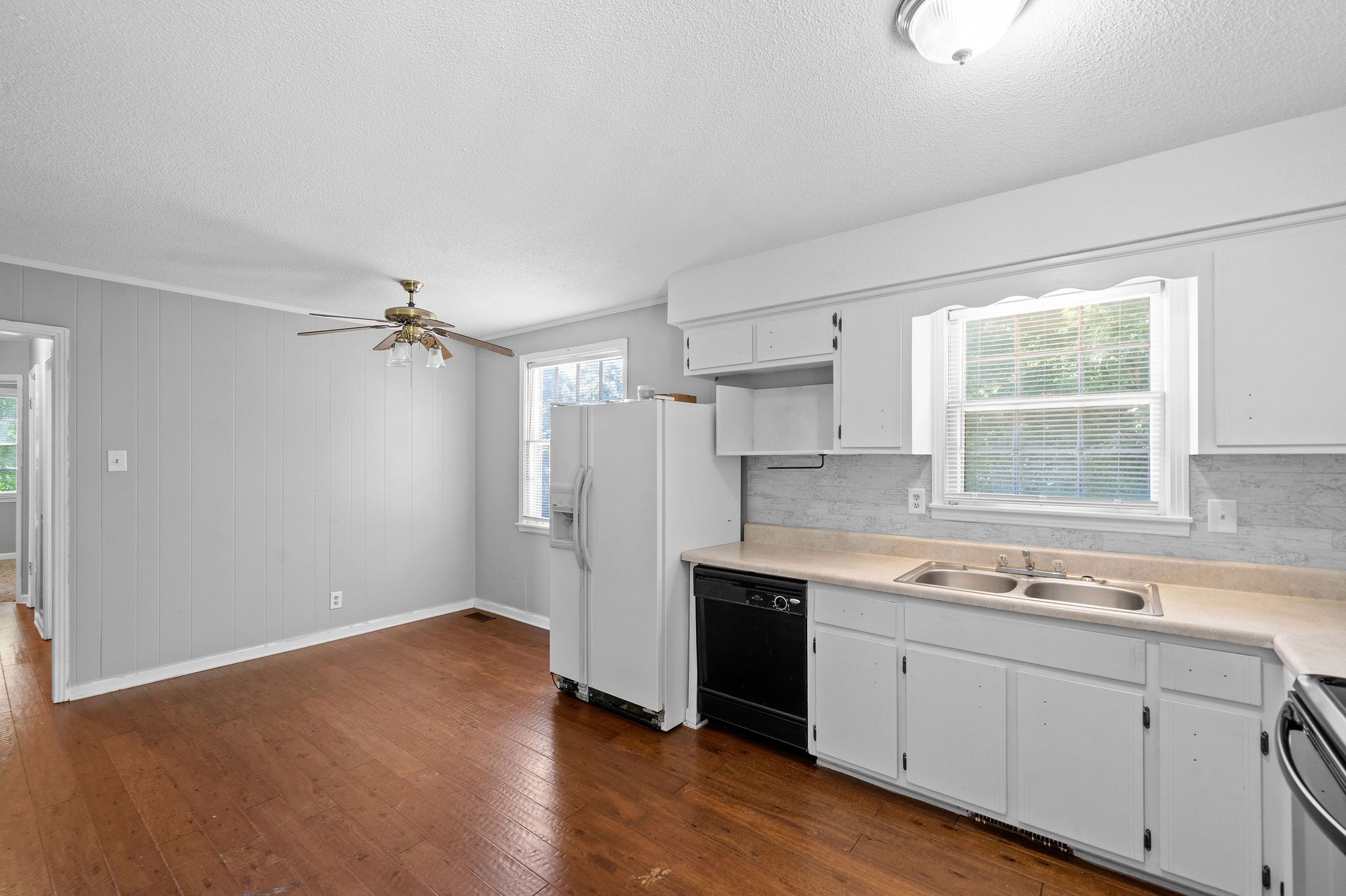 1024 Gratton Road Clarksville, TN 37043 - Photo 11 of 28 a kitchen with a sink cabinets stainless steel appliances and a window