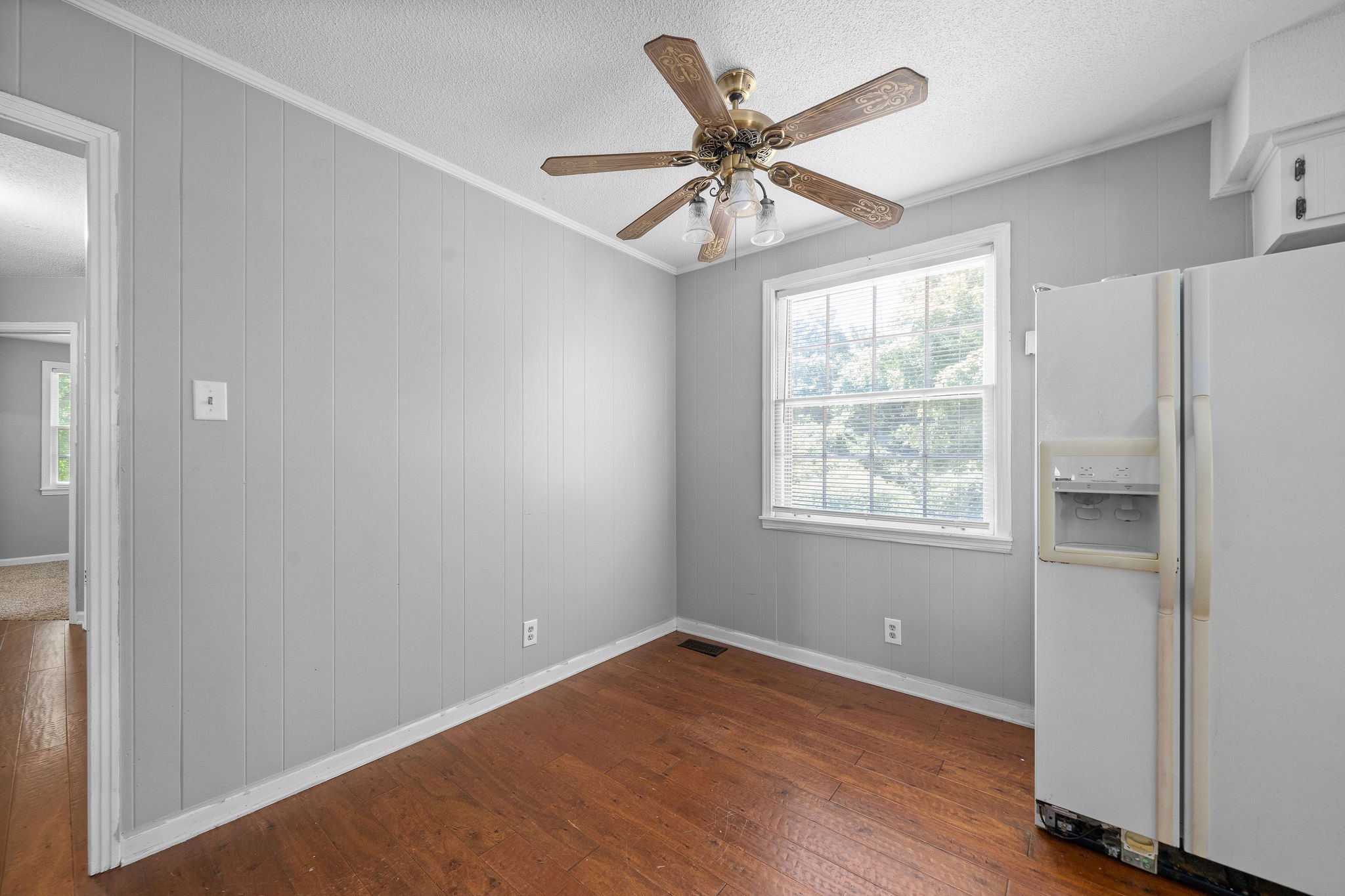 1024 Gratton Road Clarksville, TN 37043 - Photo 13 of 28 a view of an empty room with wooden floor and a window