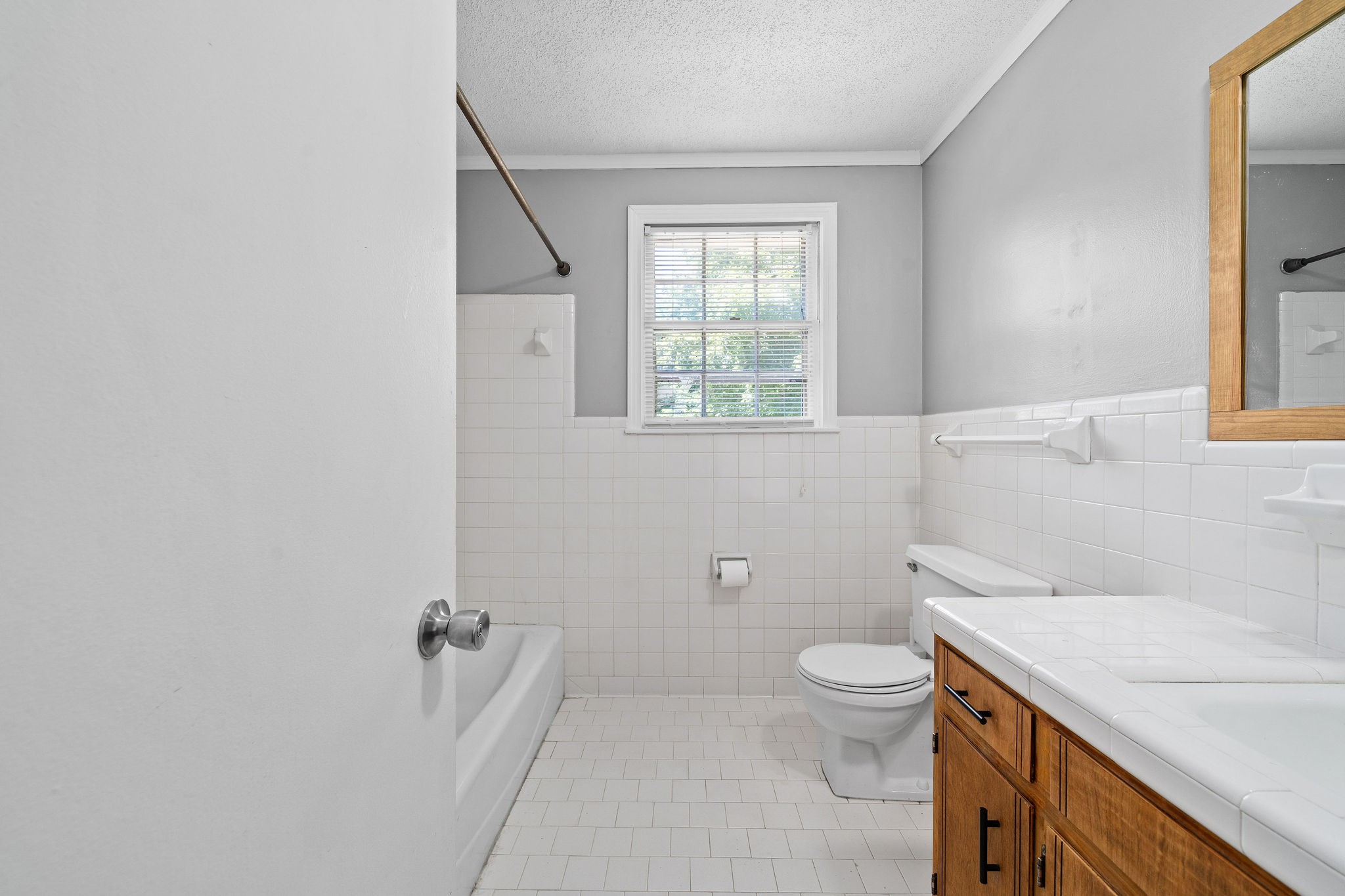 1024 Gratton Road Clarksville, TN 37043 - Photo 15 of 28 a bathroom with a sink a toilet and a window