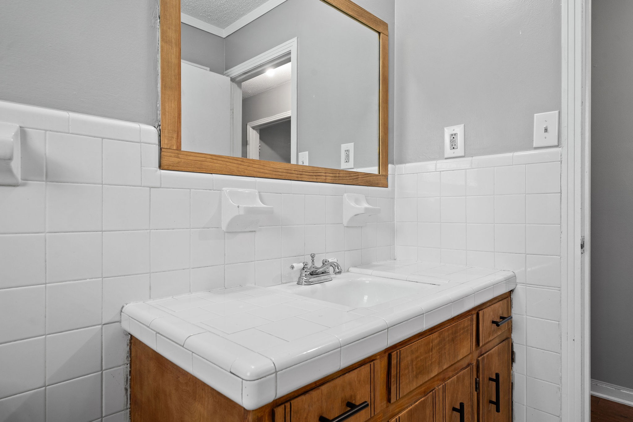1024 Gratton Road Clarksville, TN 37043 - Photo 16 of 28 a bathroom with a sink and a mirror