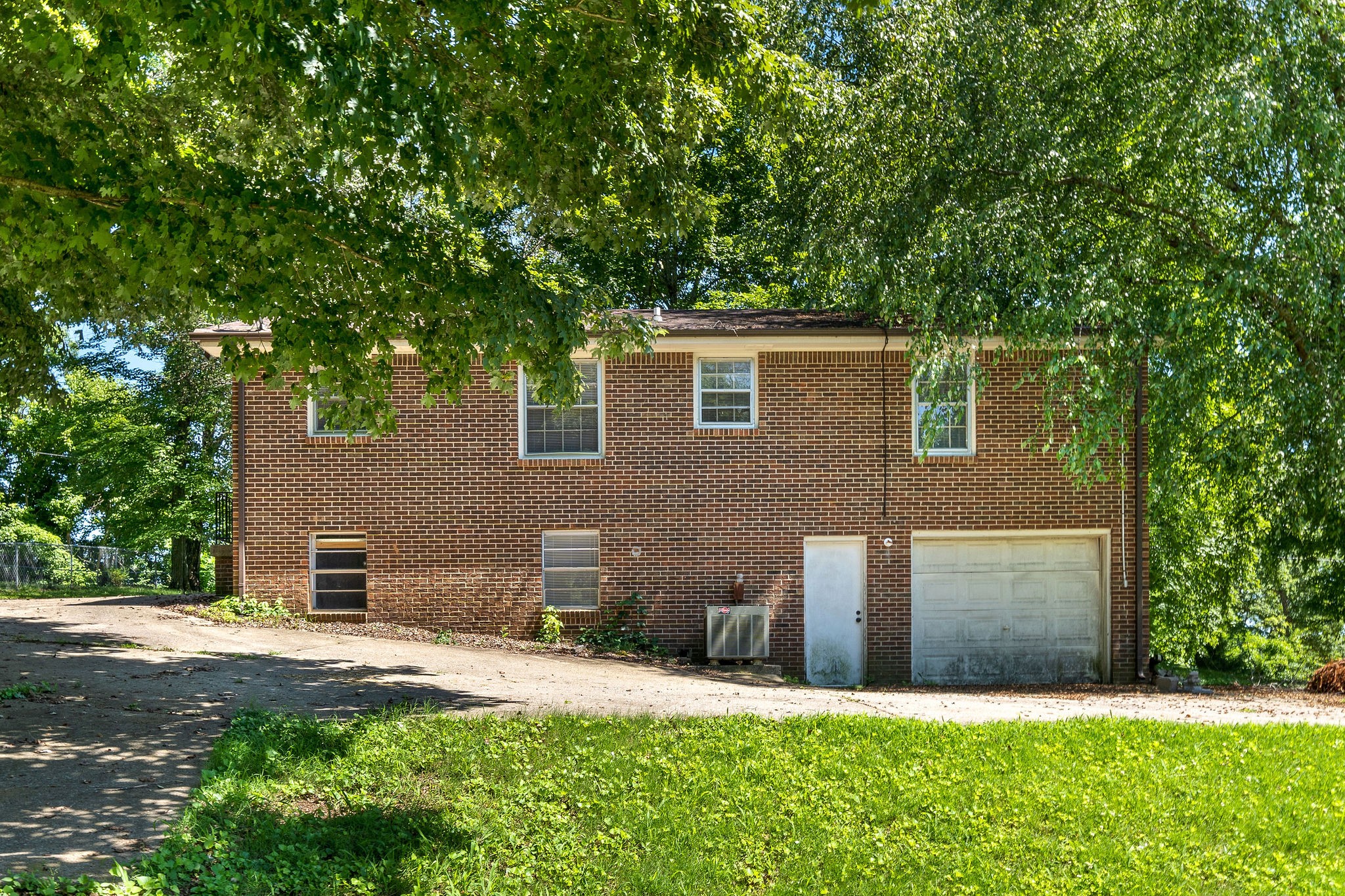 1024 Gratton Road Clarksville, TN 37043 - Photo 24 of 28 a front view of a house with a yard and garage