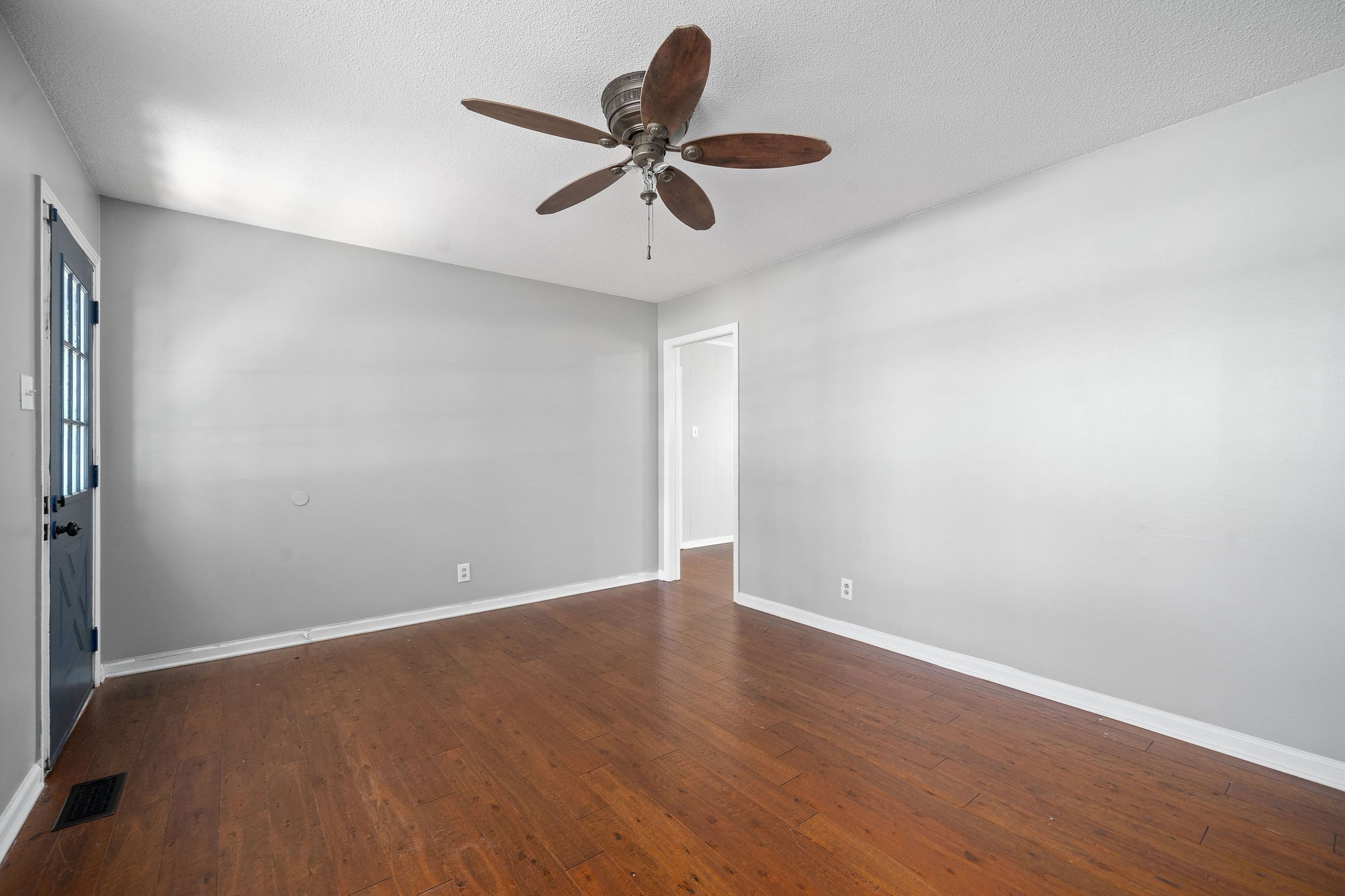 1024 Gratton Road Clarksville, TN 37043 - Photo 7 of 28 a view of room with a ceiling fan and wooden floor