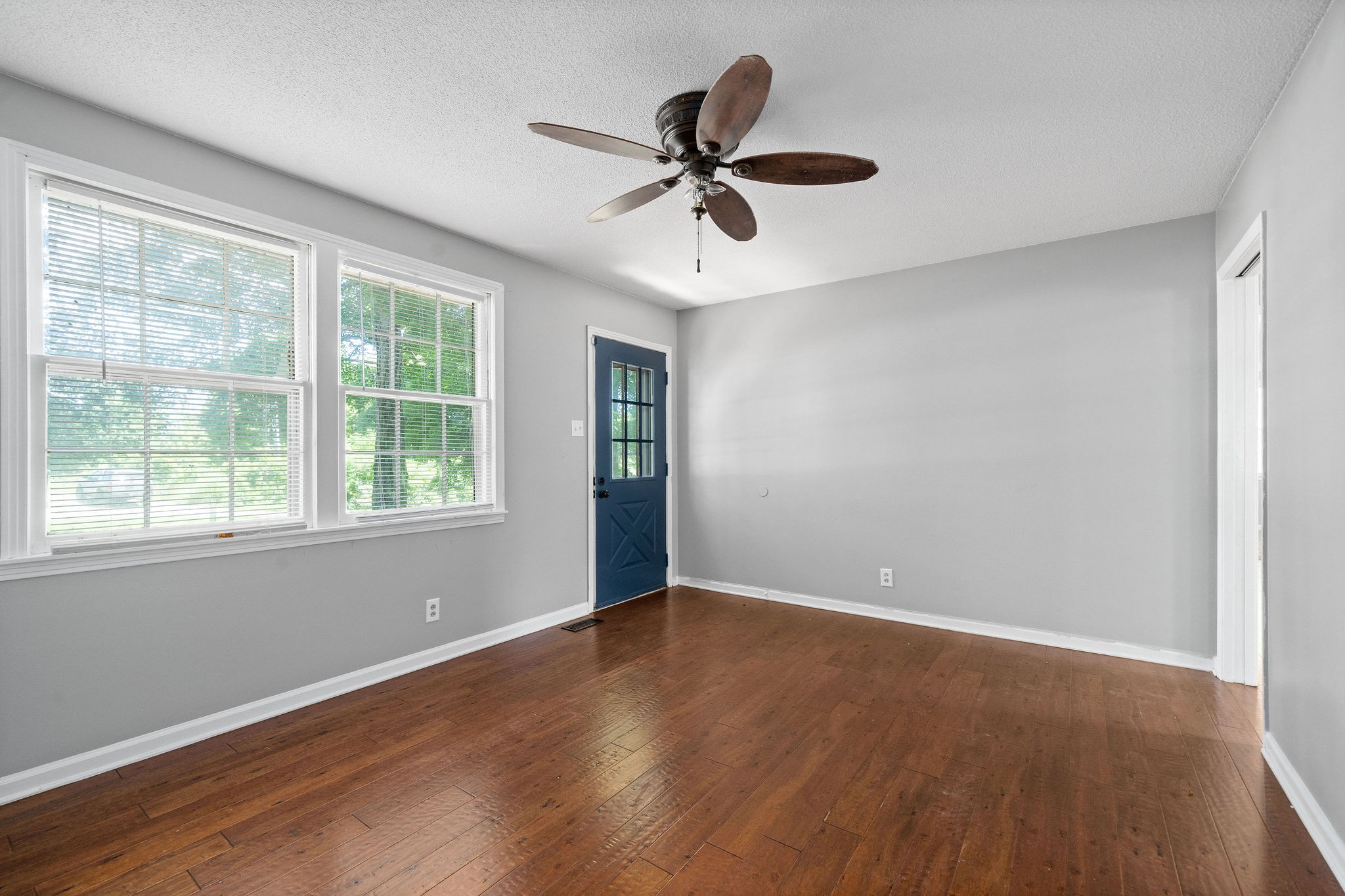 1024 Gratton Road Clarksville, TN 37043 - Photo 8 of 28 a view of an empty room with wooden floor and a window