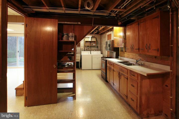 21315 Middletown Road Freeland, MD 21053 - Photo 1 of 30 a kitchen with stainless steel appliances granite countertop a stove and a refrigerator