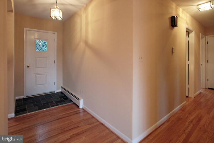 21315 Middletown Road Freeland, MD 21053 - Photo 19 of 30 a view of a hallway with wooden floor