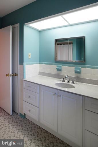 21315 Middletown Road Freeland, MD 21053 - Photo 3 of 30 a bathroom with a sink and a mirror