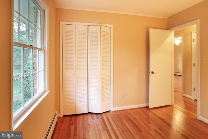21315 Middletown Road Freeland, MD 21053 - Photo 21 of 30 a view of a bathroom with wooden floor and a window