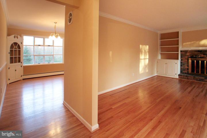 21315 Middletown Road Freeland, MD 21053 - Photo 24 of 30 an empty room with wooden floor and windows