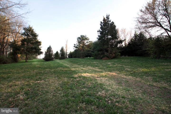 21315 Middletown Road Freeland, MD 21053 - Photo 26 of 30 a view of a field with trees in the background