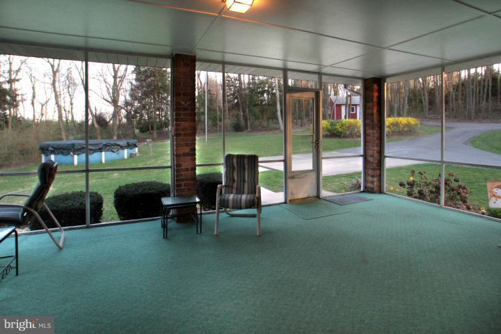 21315 Middletown Road Freeland, MD 21053 - Photo 27 of 30 a view of a porch with chairs and backyard