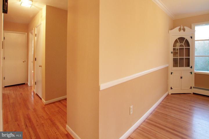 21315 Middletown Road Freeland, MD 21053 - Photo 4 of 30 a view of a hallway with wooden floor and staircase