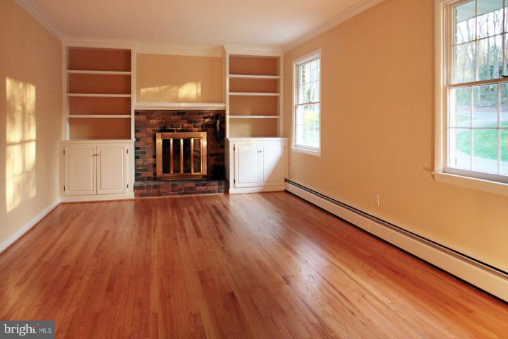 21315 Middletown Road Freeland, MD 21053 - Photo 9 of 30 an empty room with wooden floor and windows