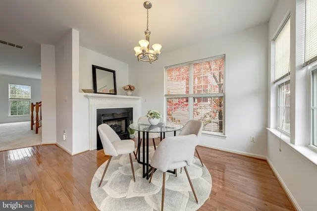 a view of a livingroom with furniture and a fireplace