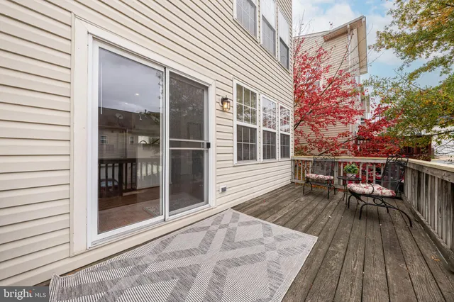 a kitchen with granite countertop a refrigerator stove microwave and cabinets