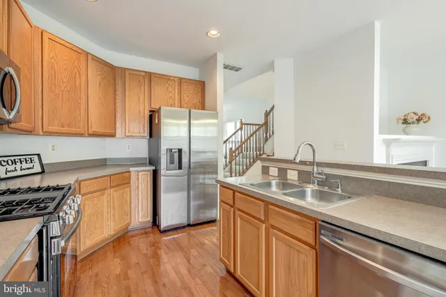 a bathroom with a sink mirror and toilet