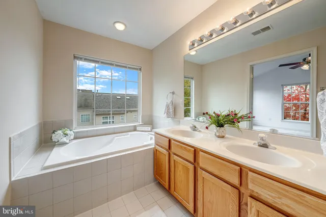 a white toilet sitting next to a bathroom sink