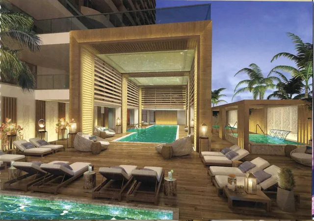 a view of swimming pool with a table and chairs