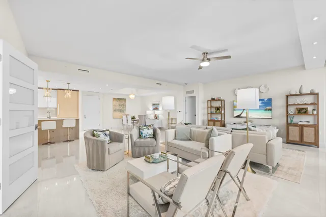 a living room with furniture a window and a table