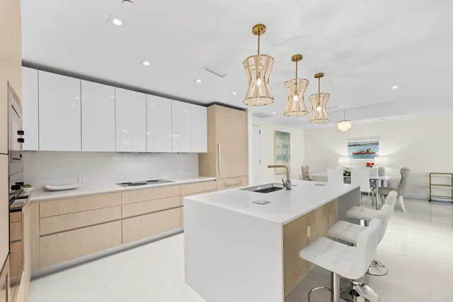 a bedroom with a bed a couch and a flat screen tv