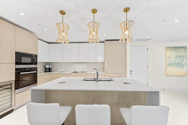 a bedroom with furniture and large window