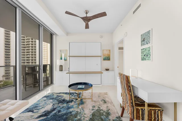 a bathroom with double vanity and a mirror