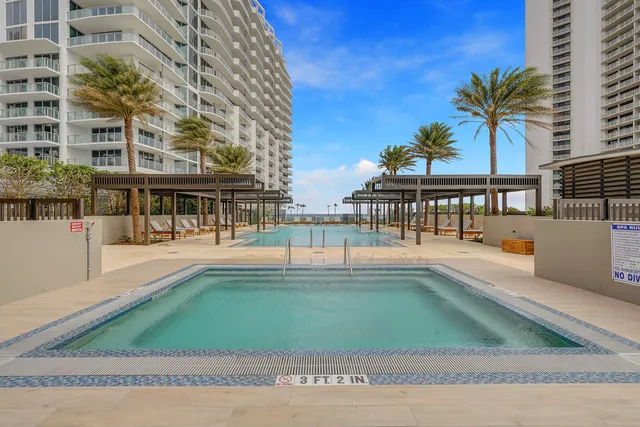 a view of a swimming pool with a patio