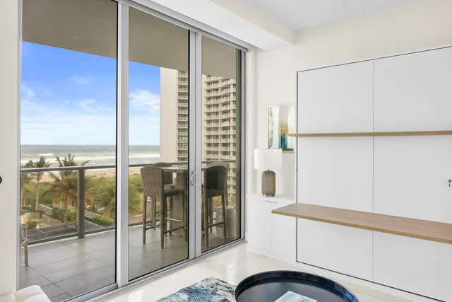 a bathroom with a tub shower vanity and a sink