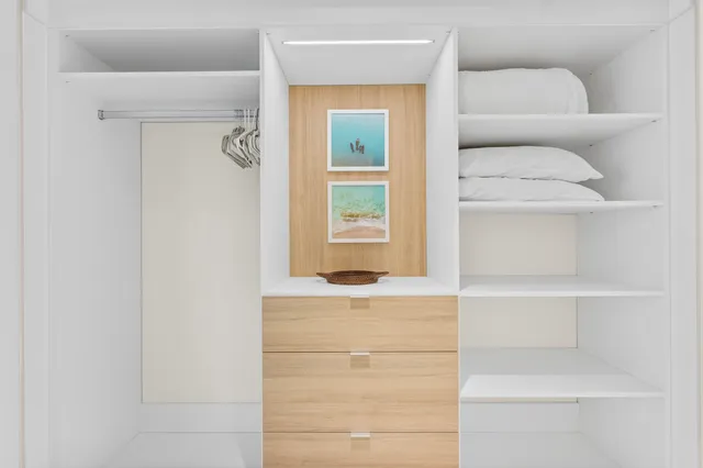 a bathroom with a balcony a sink and a mirror